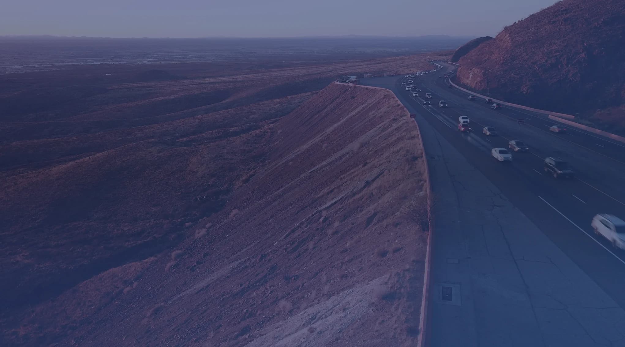 A highway winding along the desert hills above El Paso, Texas, near Fort Bliss