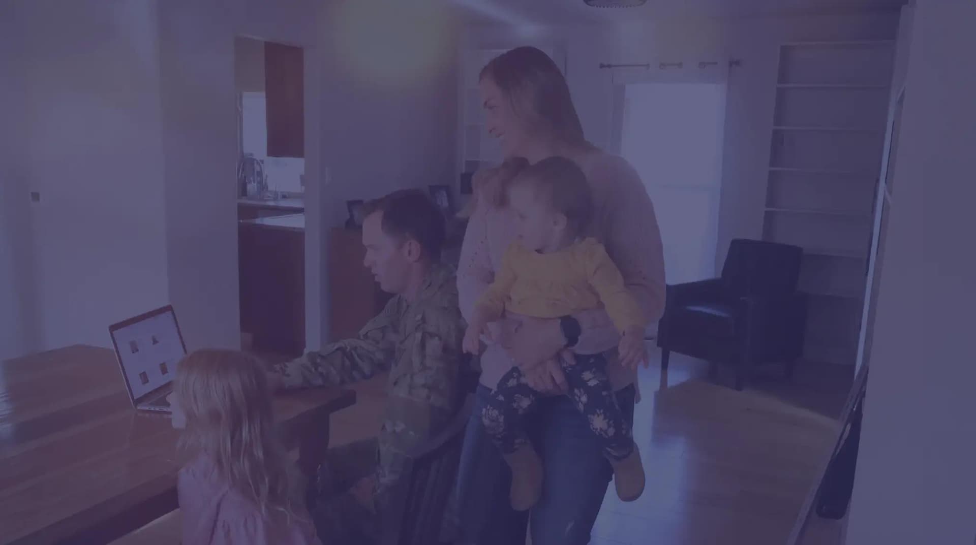Military members moving into their new home with their two children.