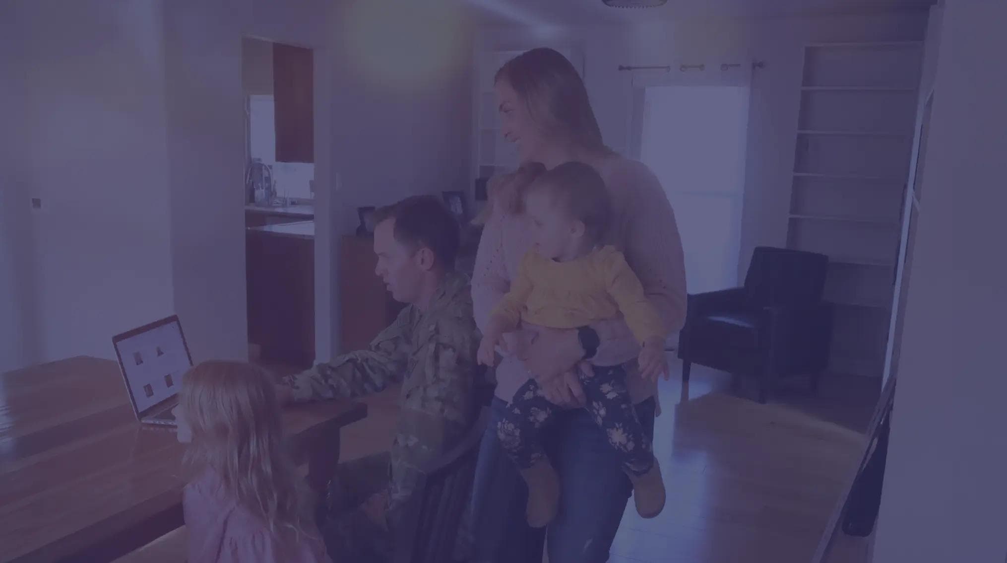 Military members moving into their new home with their two children.