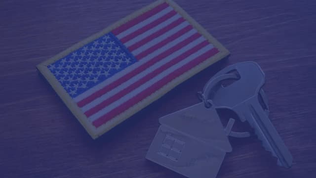 An American flag military patch next to new keys to a newly closed home using the VA loan