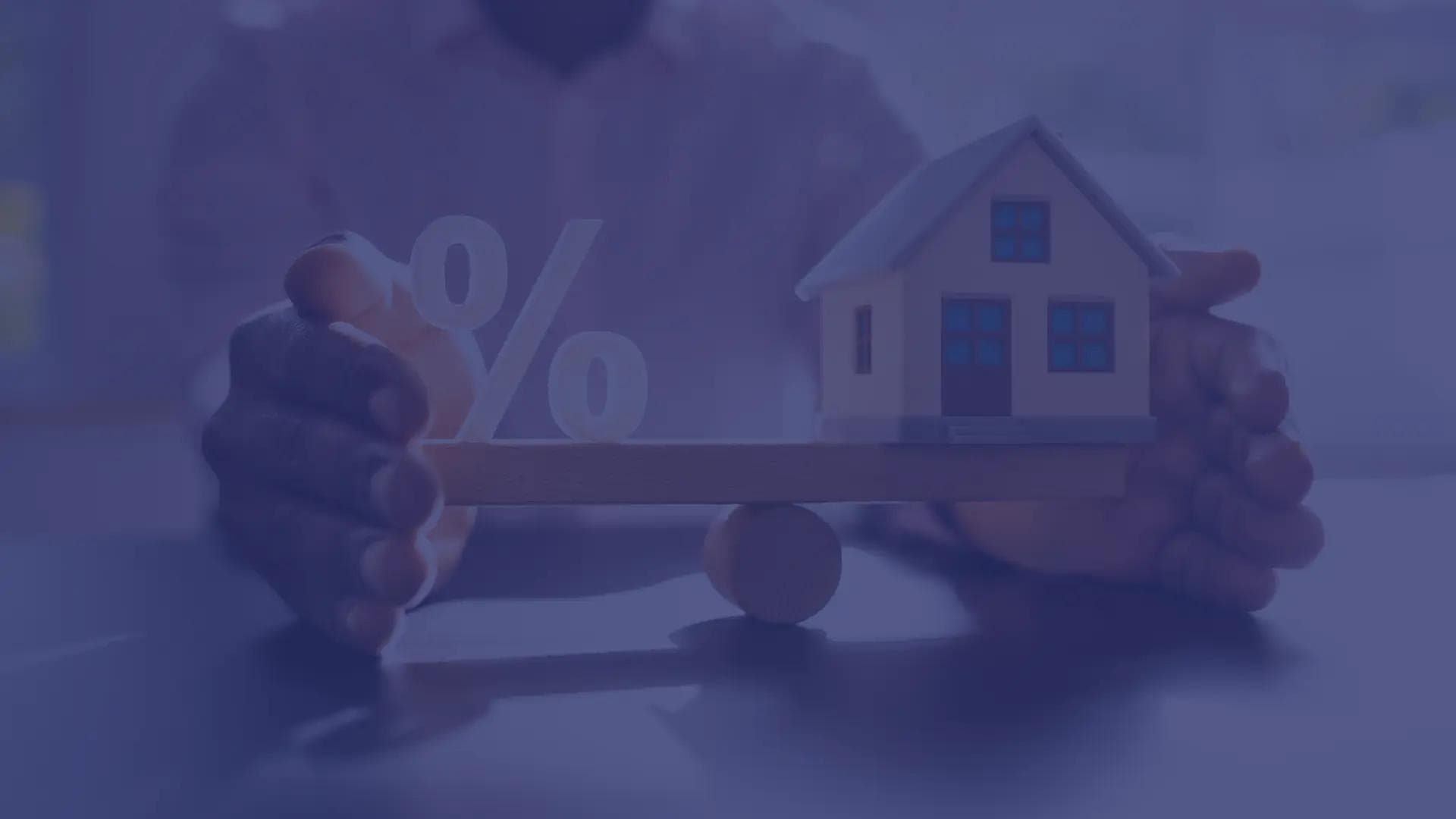 A home and interest rate balancing on seesaw.