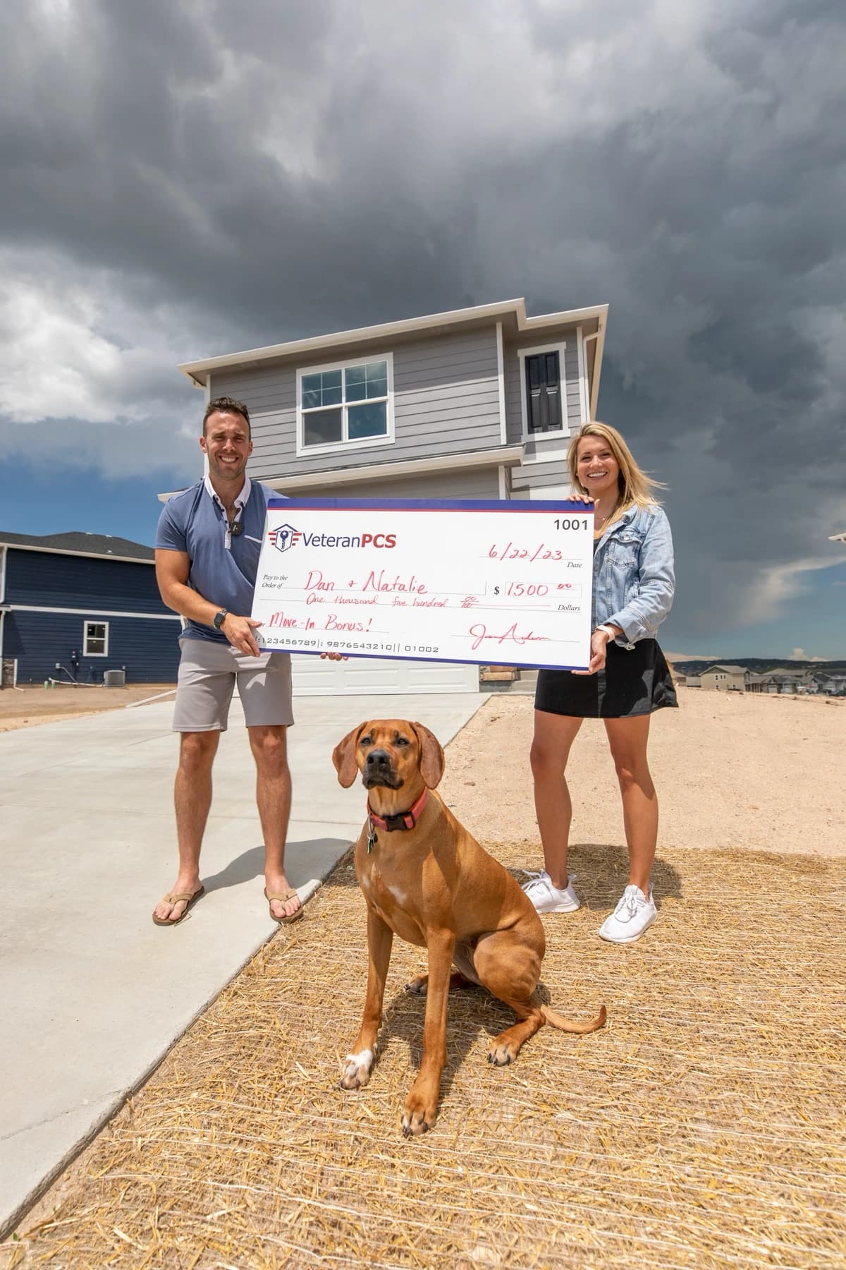 VeteranPCS family receiving a move-in bonus check