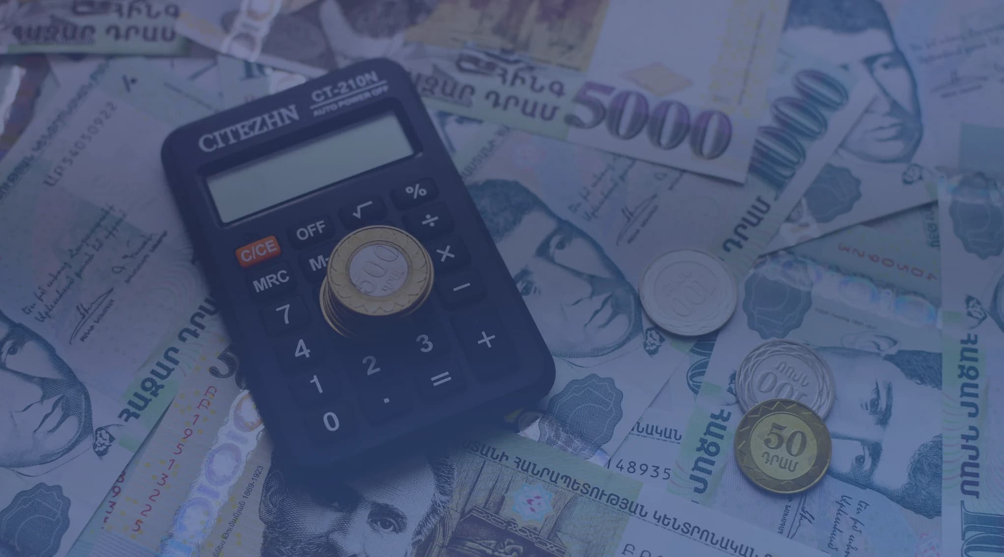 A house and calculator representing 2026 VA loan limits for military homebuyers