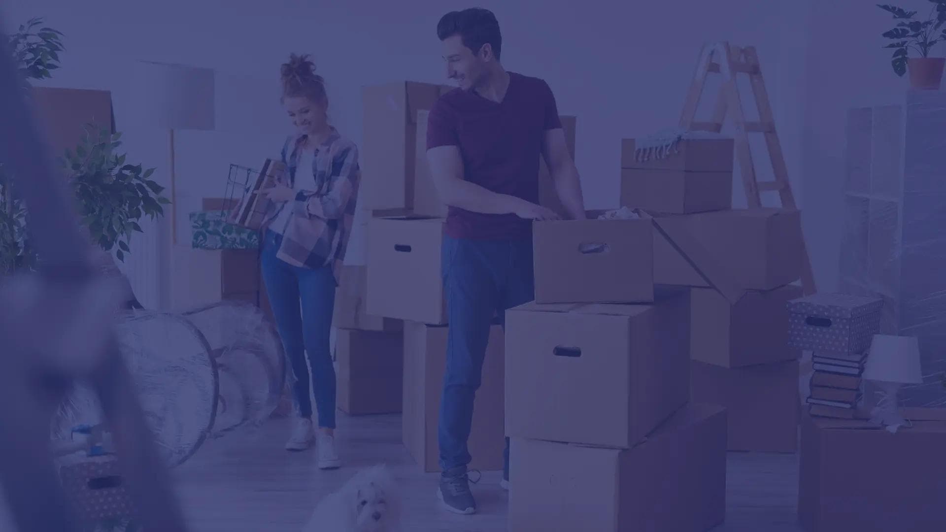 A happy military couple prepares moving boxes for their upcoming PCS.