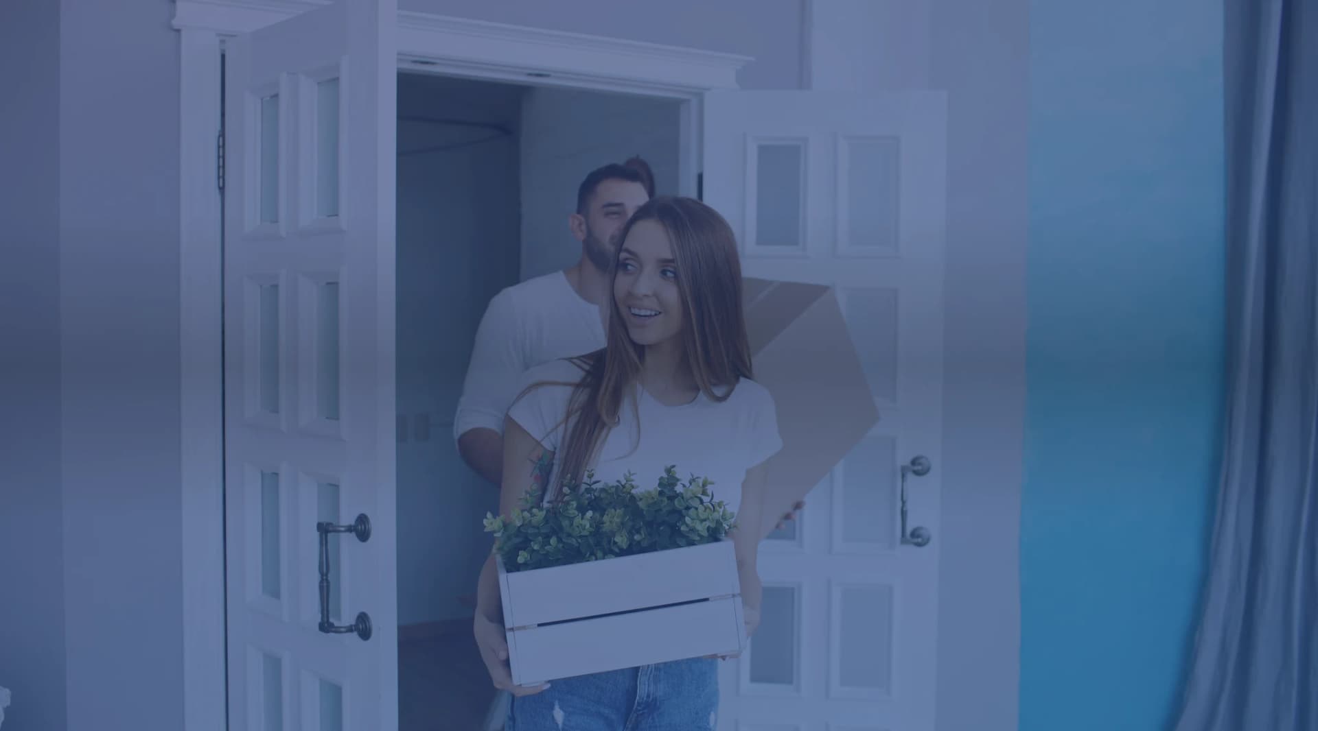 Military couple touring a home with a real estate agent