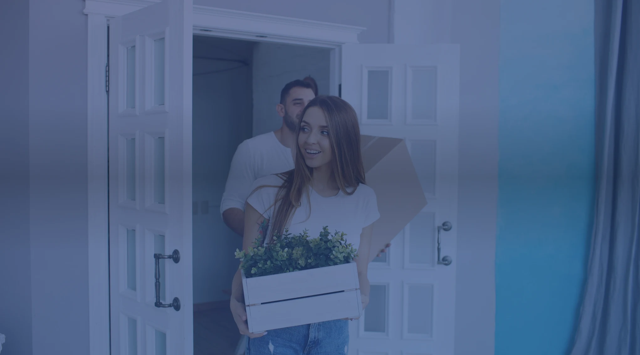 Military couple touring a home with a real estate agent