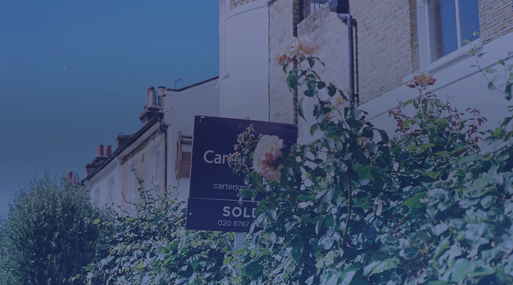 Sold sign in front of a military family's home after a PCS move