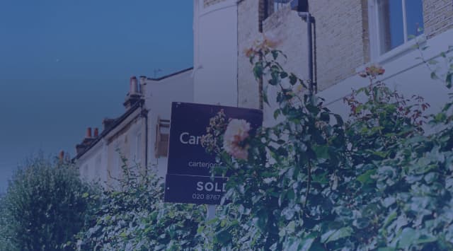 Sold sign in front of a military family's home after a PCS move