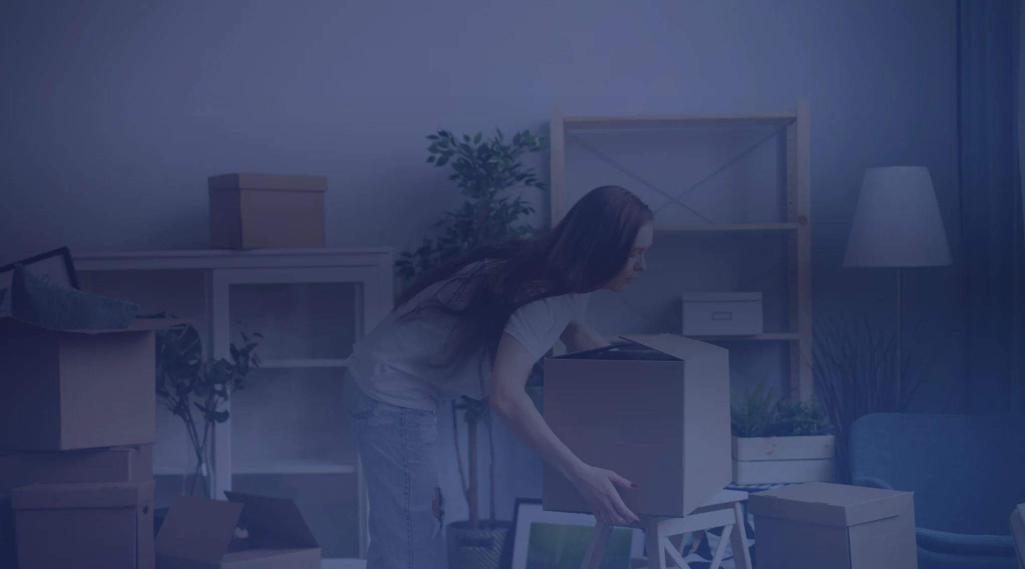 Moving boxes and tax paperwork representing the military moving expenses tax deduction