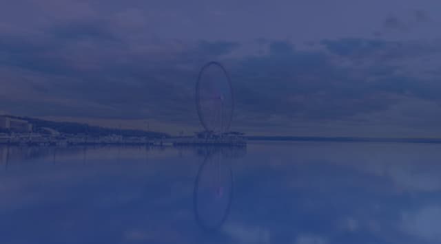 The Capital Wheel ferris wheel reflected in the Potomac River at National Harbor, Maryland, near Joint Base Andrews