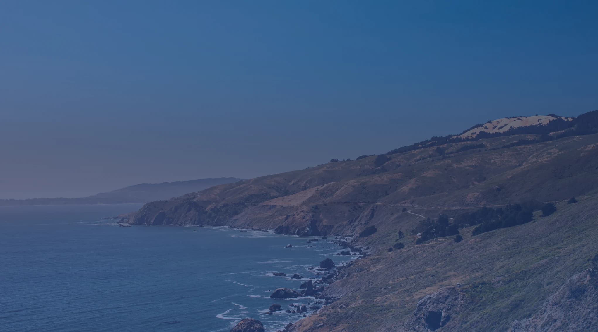 A Southern California coastline of bluffs, beach, and the Pacific, like the Oceanside area near MCB Camp Pendleton.