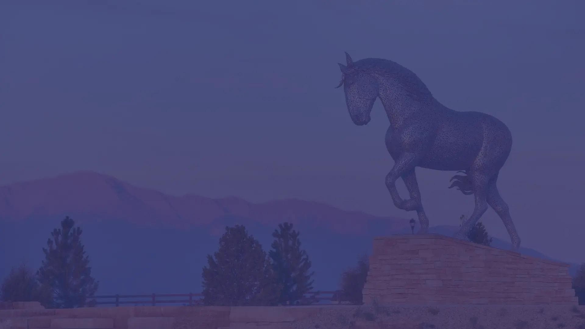 Belle, a draft horse statue overlooking the Percheron Master-Planned community at sunset.
