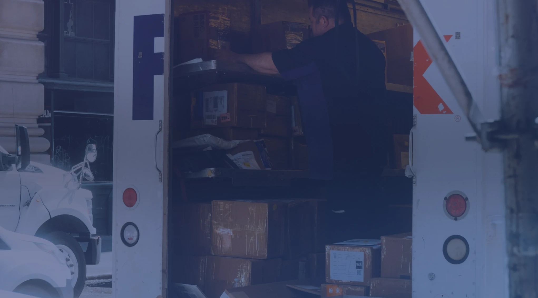 Service member loading boxes into a moving truck during a PCS move