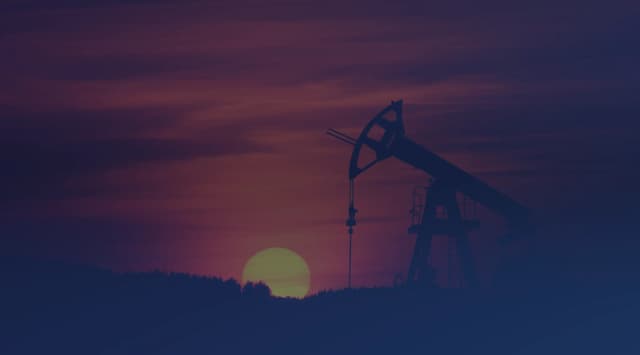 An oil pump jack silhouetted against an evening sky, a reminder of the oil and gas industry that shapes life in the Permian Basin around Midland and Odessa.