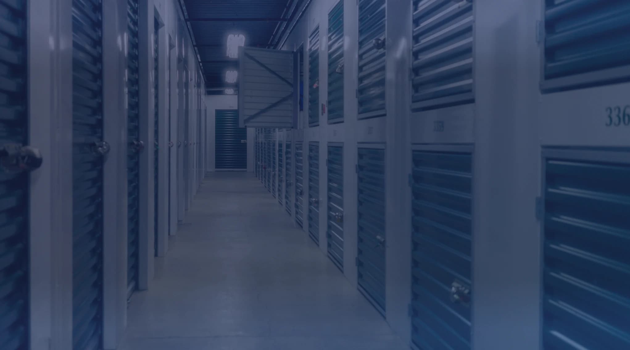 A hallway of locked storage units at a temporary storage facility