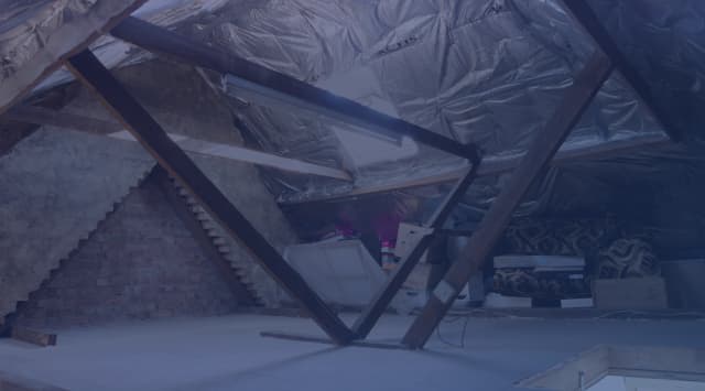 Attic insulation being installed in a home financed with a VA loan