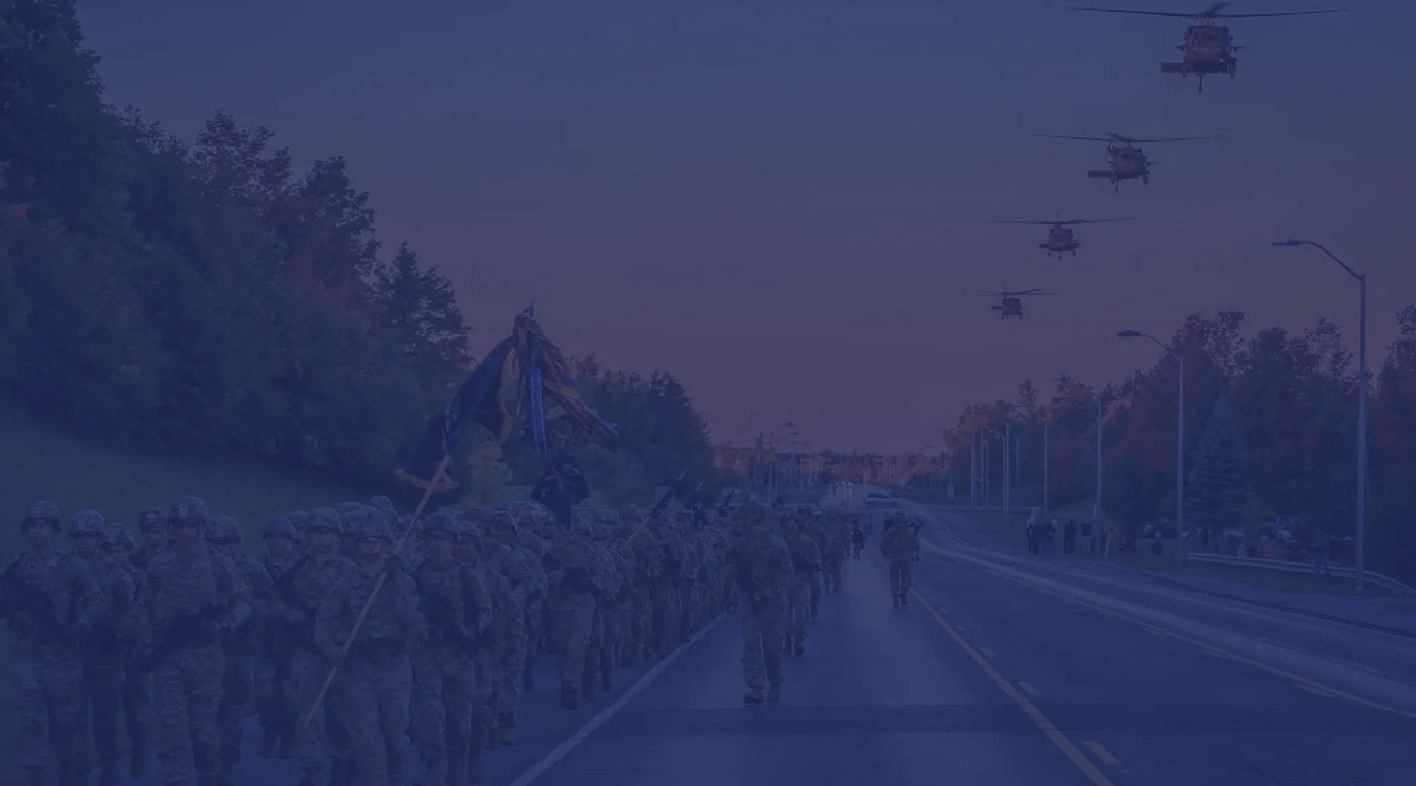 U.S. Army troops do a company run down the road.